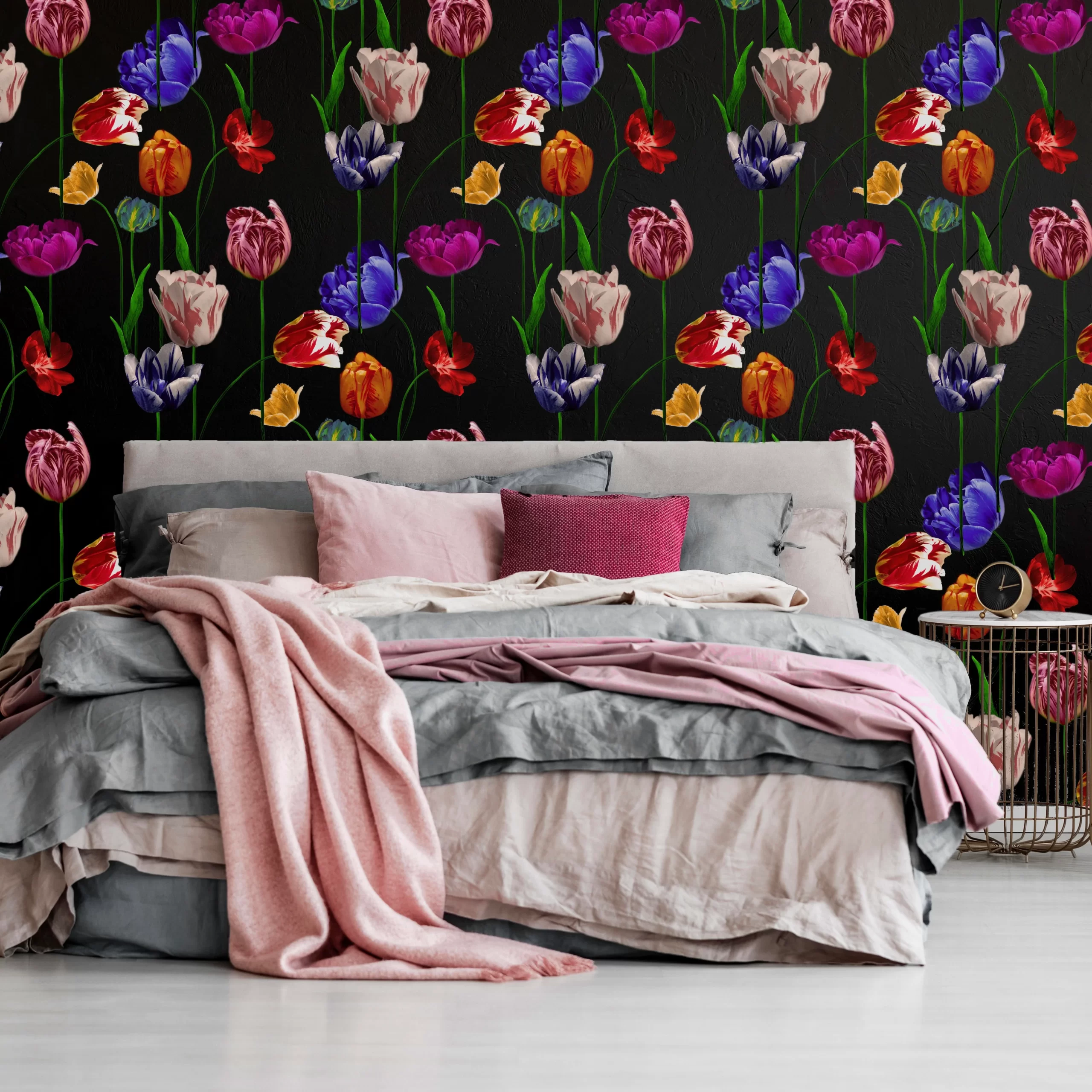tulip wallpaper in bold colours seen behind a bed