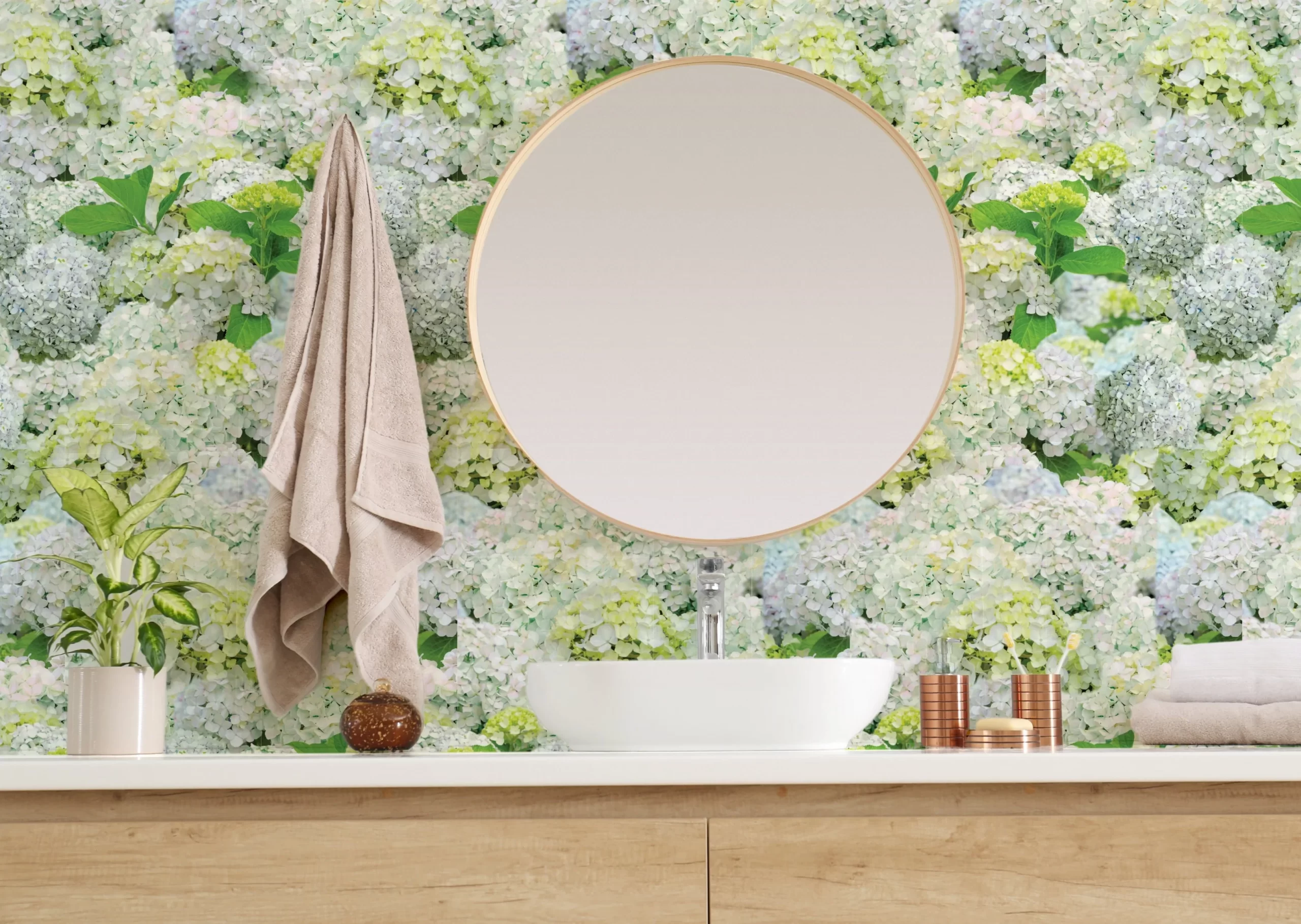 Sink and mirror in bathroom featuring large scale hydrangea wallpaper pattern on wall