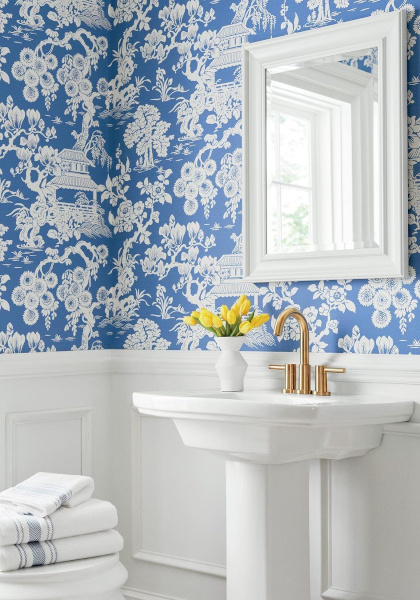 Japanese inspired wallpaper of a Eastern style garden. Blue and white wallpaper hung here in a bathroom