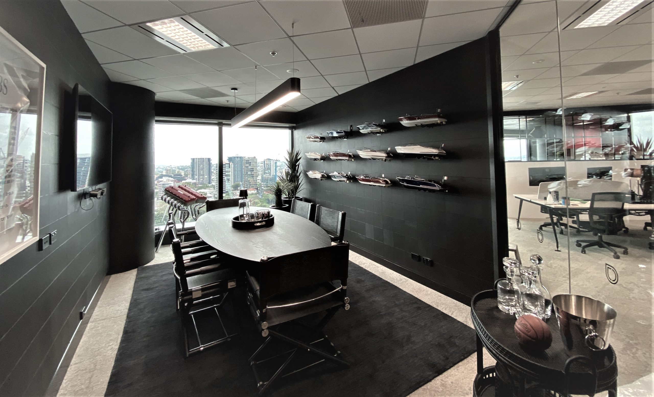 Black wallpaper in a leather tiled effect by Arte in a boardroom