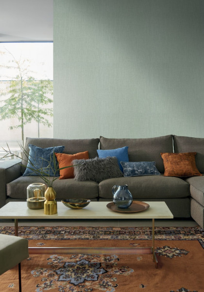 Shinok sage green wallpaper in a living room of natural earthy colours