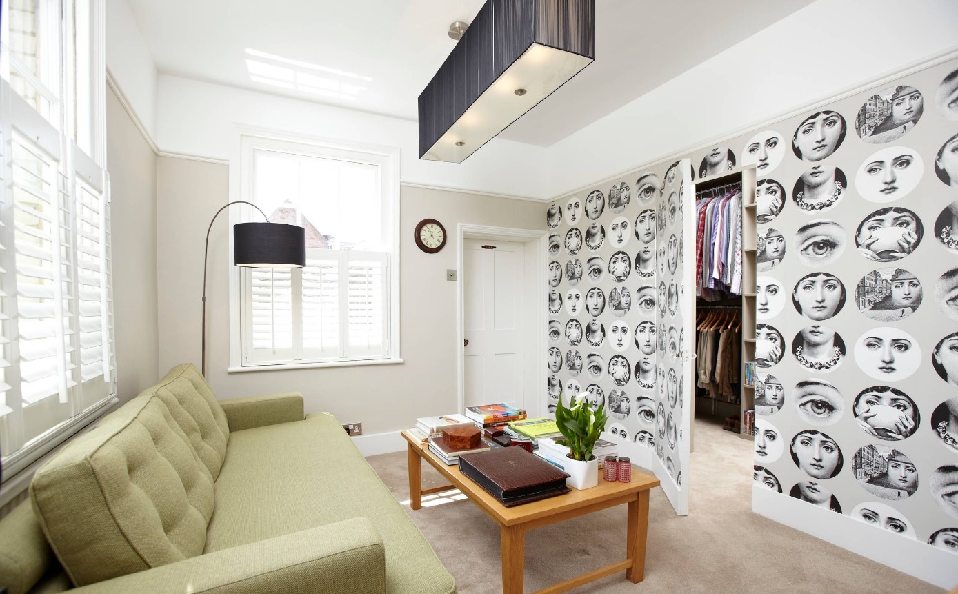 Etons of Bath photo from Houzz featuring faces wallpaper over a "hidden" door and wall
