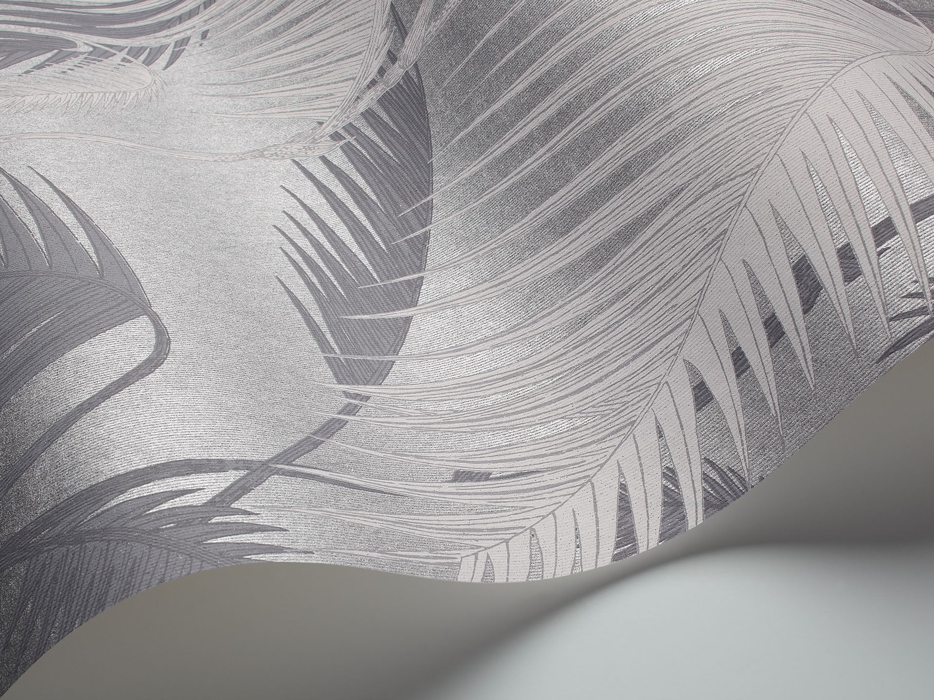 silver toned wallpaper of palm leaves by Cole and Son - Palm Jungle