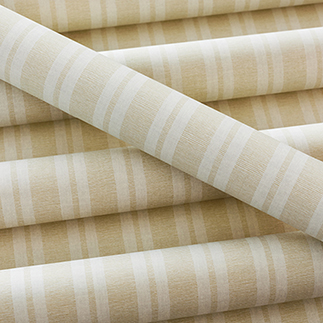 A pile of wallpaper rolls Ryland Stripe by Anna French Devon collection
