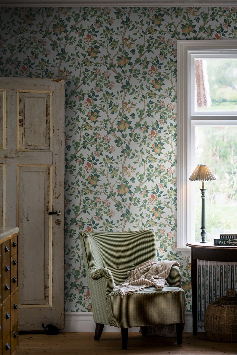 Roomshot of farmhouse style interior featuring wallpaper with fruit on branches