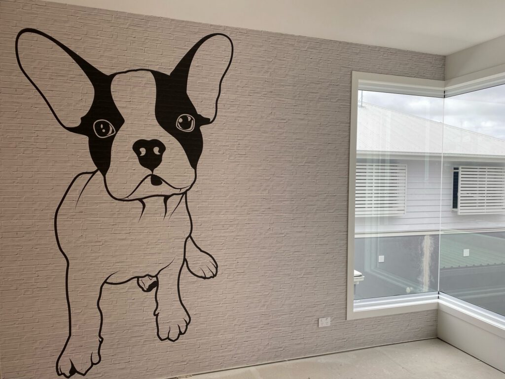Dog mural on faux brick wallpaper