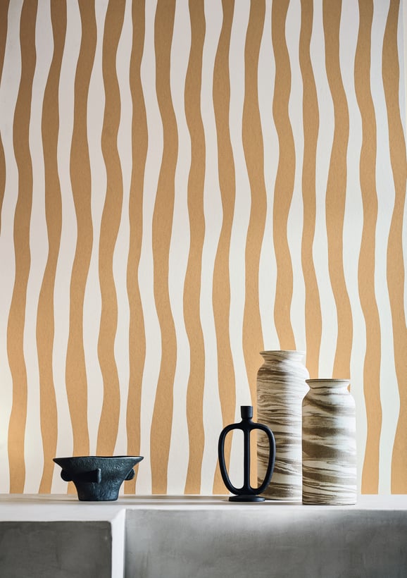 wobbly stripes feature in this peach coloured stripe wallpaper