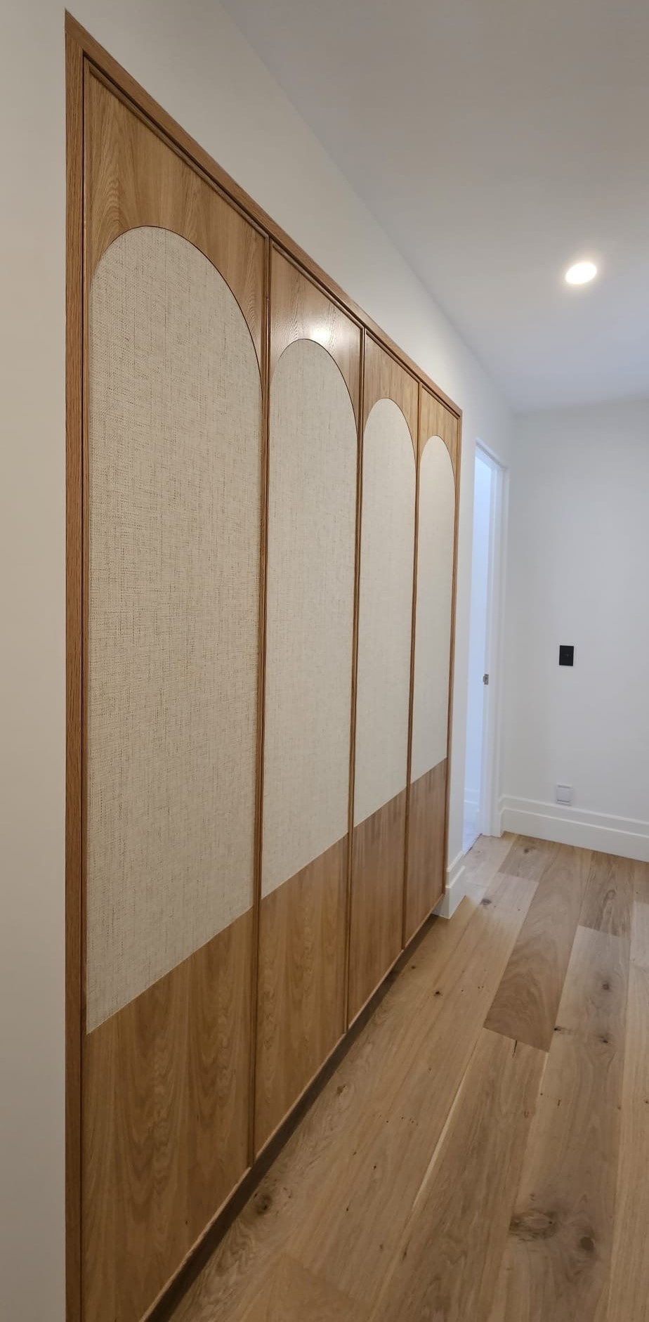 Linen look wallpaper applied to wardrobe panels