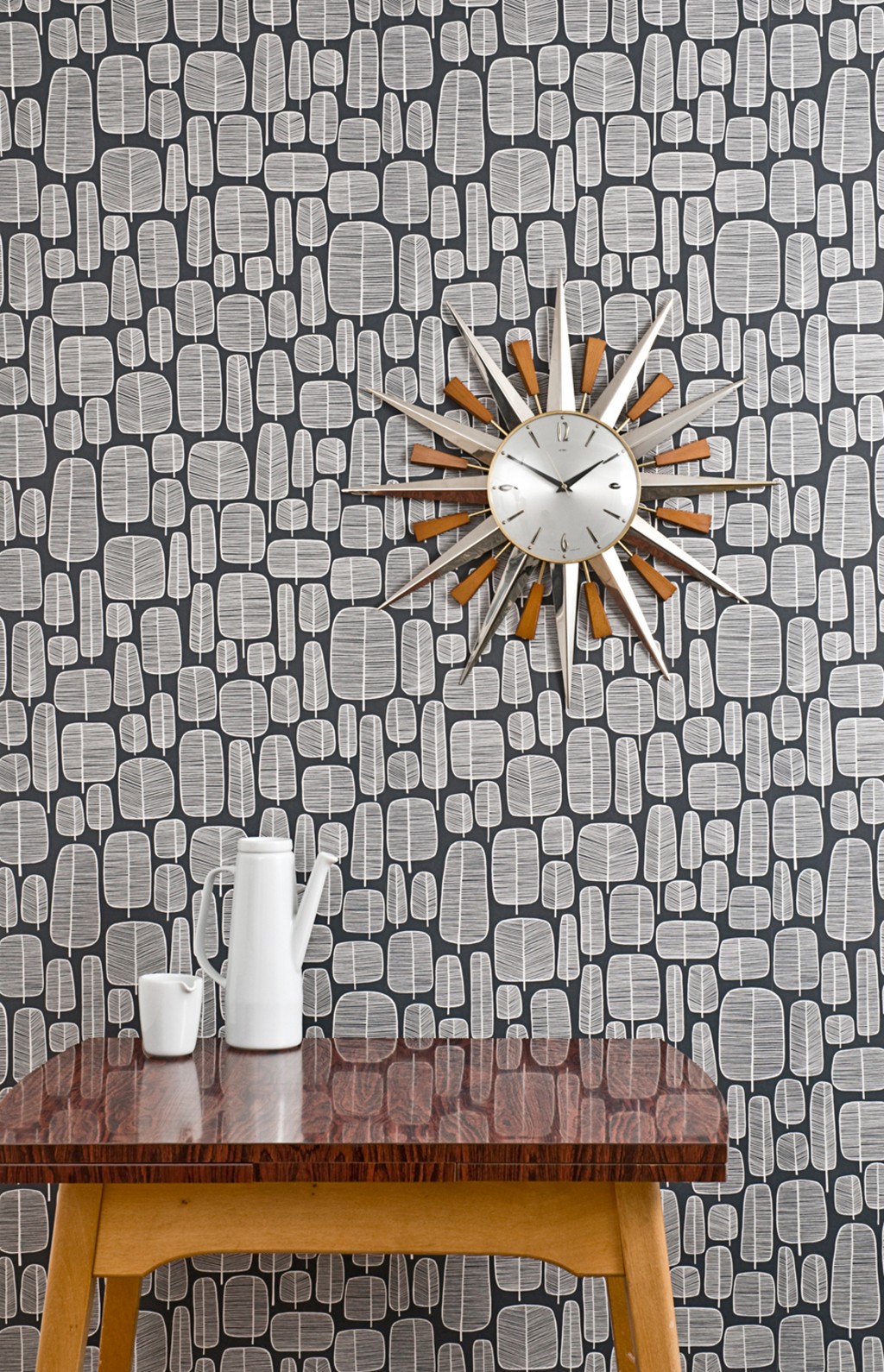Styled room shot of Little Trees wallpaper charcoal in Mid Century Modern style.