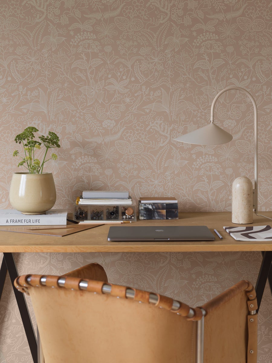 Mocha coloured wallpaper on trend interior colour. Illustration style wallpaper pattern in a home office