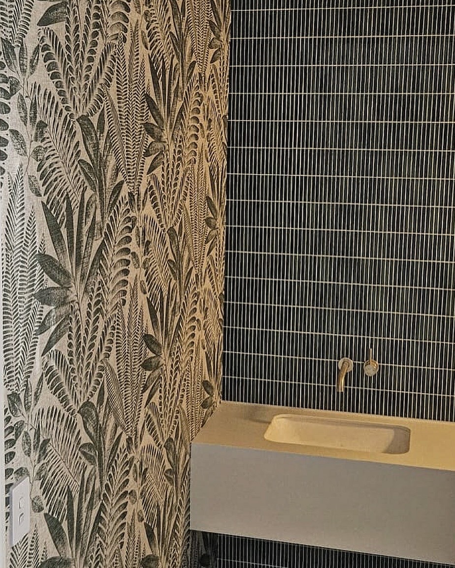 Aloe Leaves in Green a popular wallpaper shown here in a powder room