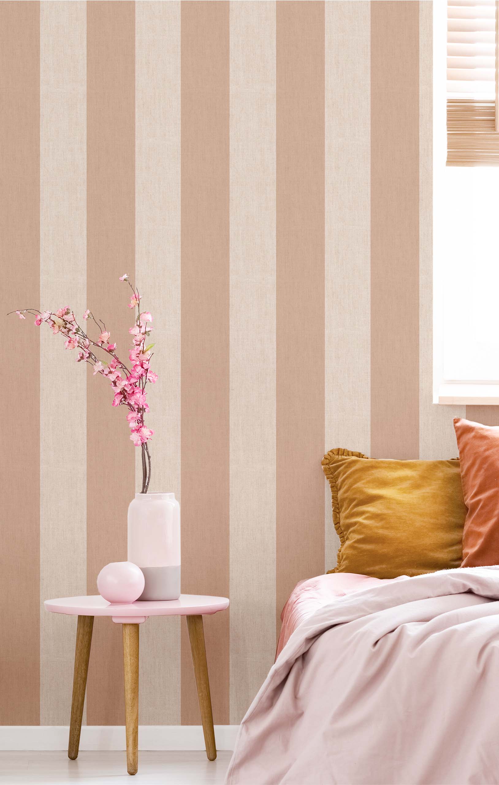 Extra wide stripes feature in this wallpaper for a bedroom