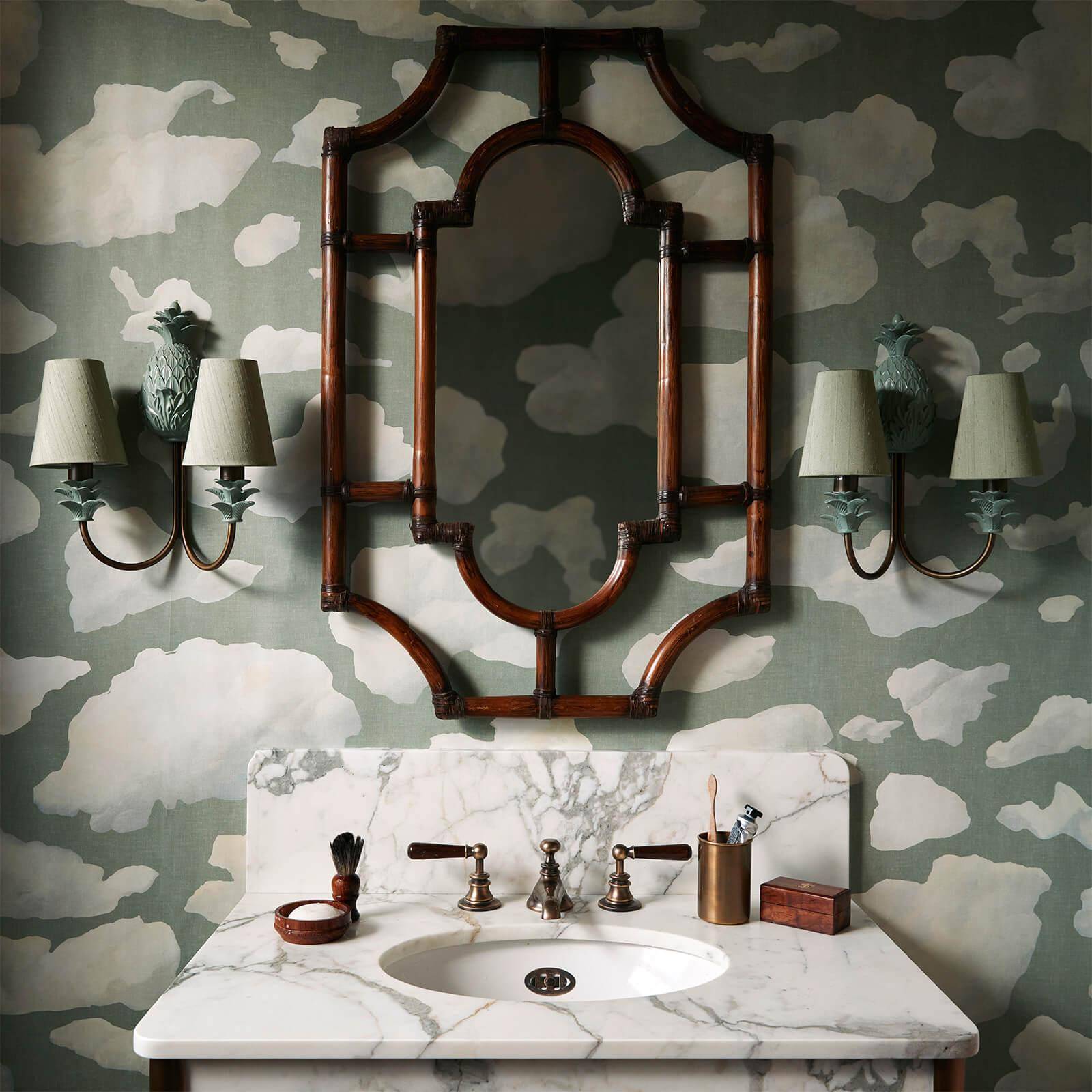 Cloud wallpaper on a sage green background in a toilet