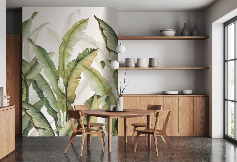 Oversized green palm leaf mural in a kitchen dining room.