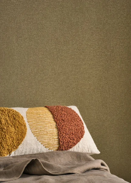 Textured wallpaper in a bedroom in earthy colours