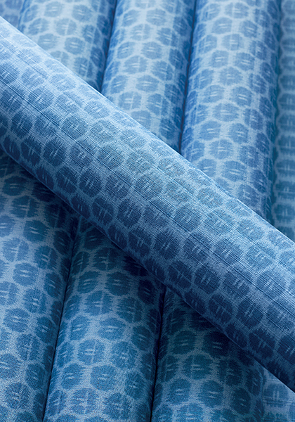 Rolls of blue Pavilion Akari wallpaper